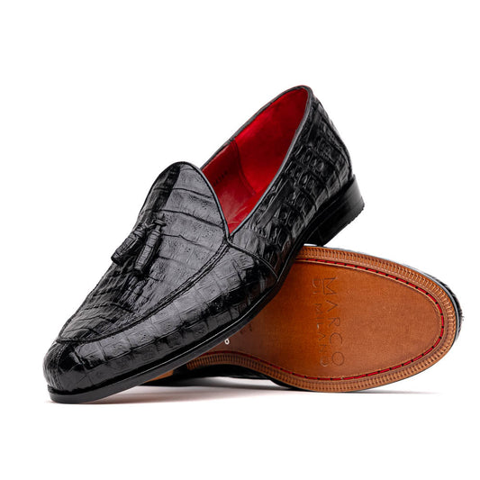 Experience luxury with the Marco Di Milano Bianchi Black—a pair of genuine caiman crocodile tassel loafers featuring black crocodile-patterned leather, red interior lining, and tan leather soles.