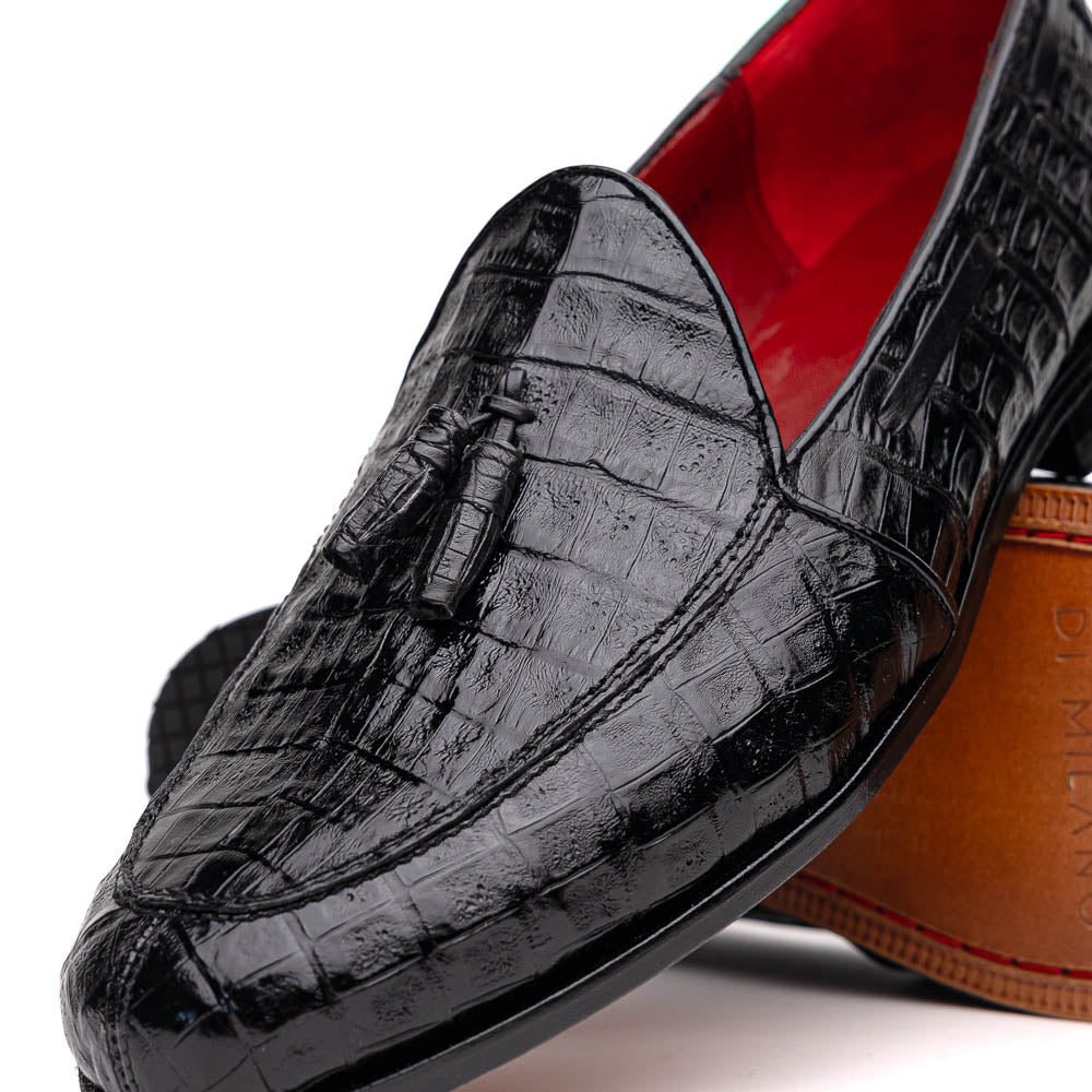 Experience luxury with the Marco Di Milano Bianchi Black—a pair of genuine caiman crocodile tassel loafers featuring black crocodile-patterned leather, red interior lining, and tan leather soles.