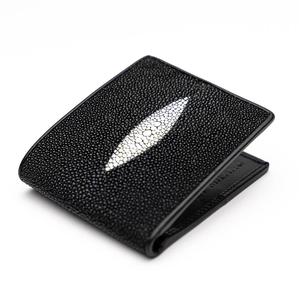 The Marco Di Milano Vallo Wallet Black is a textured luxury men's wallet with a central oval reflective accent, shown partially open on a white background.
