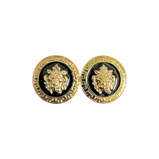 The Matiste Black/Gold Cufflinks by Matiste feature a round design with a raised lion head center and patterned border.