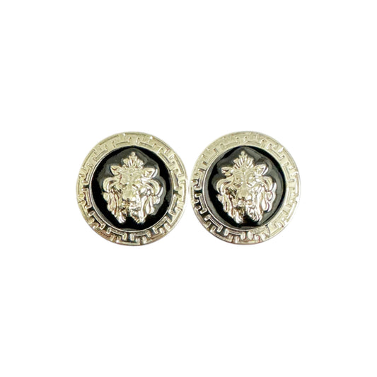 A pair of Matiste Black/Silver cufflinks featuring a raised lion head design in the center, inspired by the bold elegance of Italian accessories.