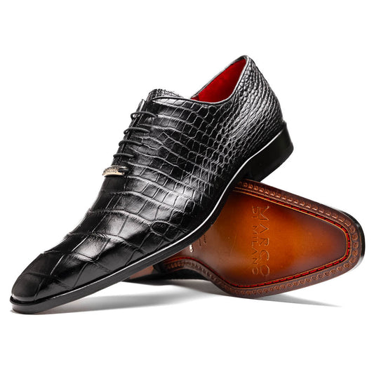 The Marco Di Milano Bono Black features a pair of luxury dress shoes in a crocodile pattern—one upright and one displaying a brown branded sole.