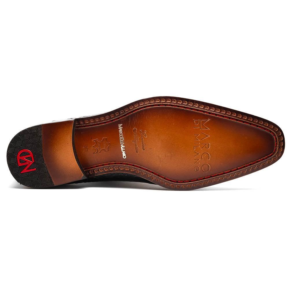 The Marco Di Milano Bono Black features a pair of luxury dress shoes in a crocodile pattern—one upright and one displaying a brown branded sole.