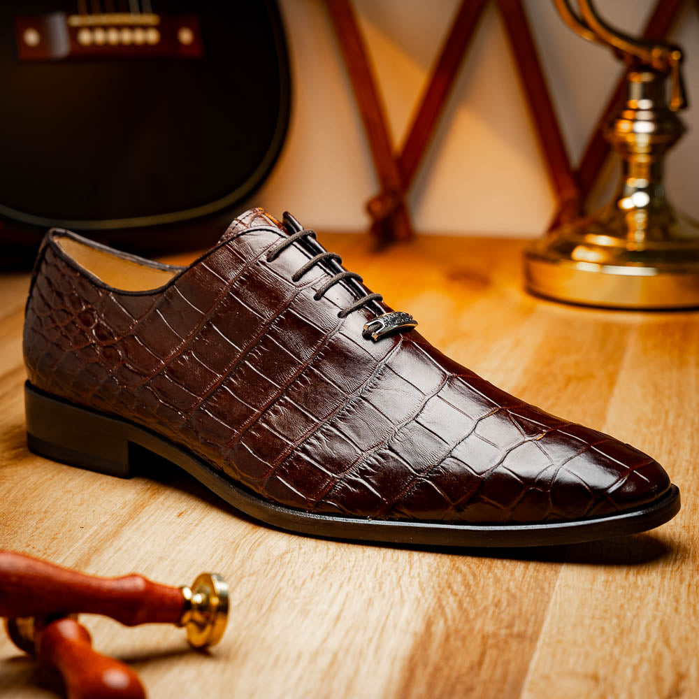 The Bono Brown by Marco Di Milano: genuine alligator Oxfords in brown—one upright displaying laces, the other showing the sole and stitching—a stunning example of luxury footwear.