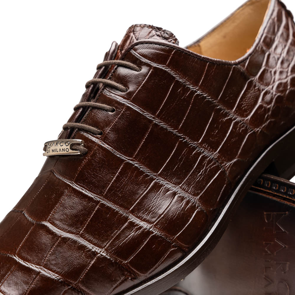 The Bono Brown by Marco Di Milano: genuine alligator Oxfords in brown—one upright displaying laces, the other showing the sole and stitching—a stunning example of luxury footwear.