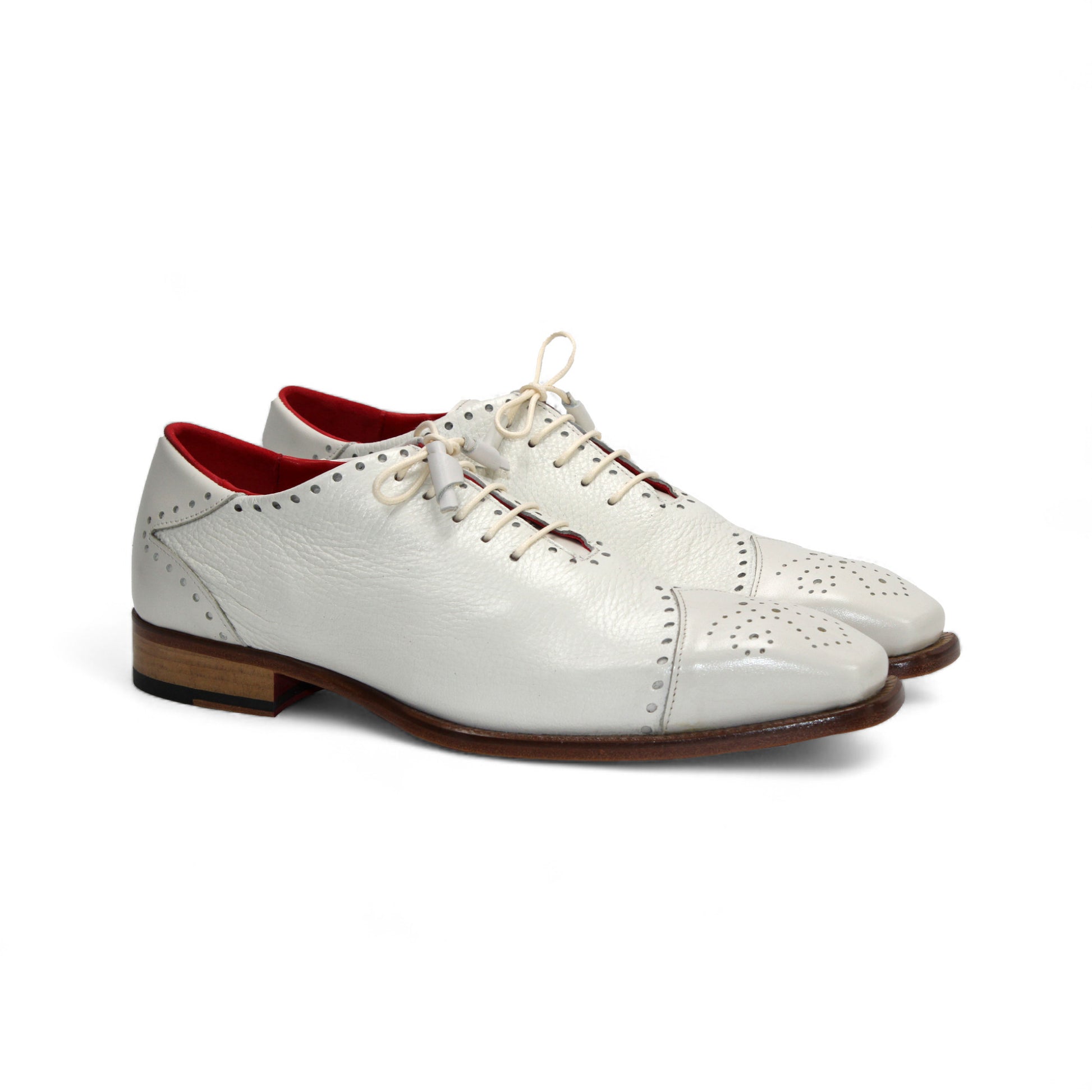 The Emilio Franco Bosco Bone is a handcrafted Italian oxford shoe in white genuine leather, featuring decorative perforations, a low wooden heel, red inner lining, and shown in profile on a white background.