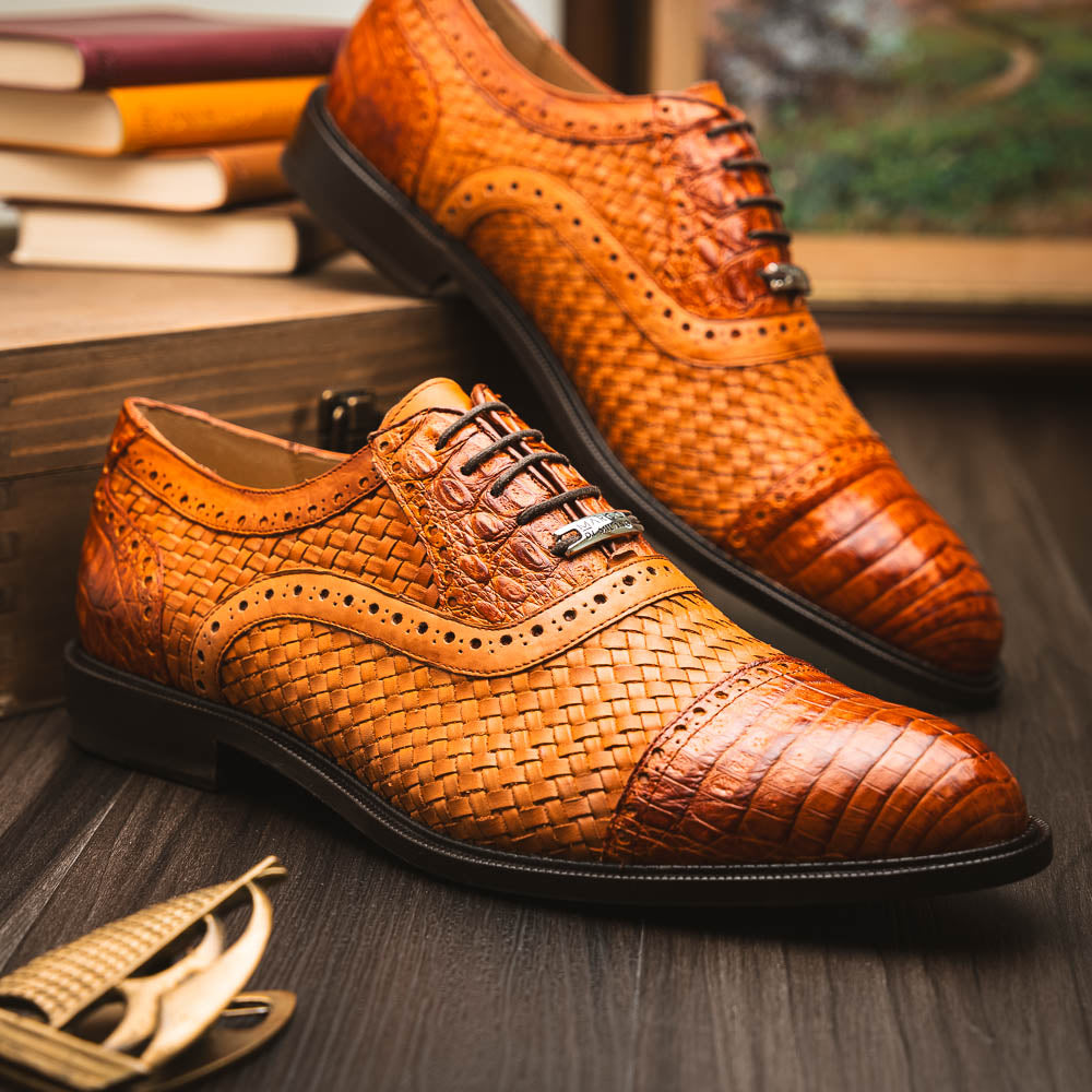 The John Brandy by Marco Di Milano is a pair of brown men’s oxford dress shoes with woven and textured leather, black laces, and stitched leather soles—ideal for those seeking luxury footwear.