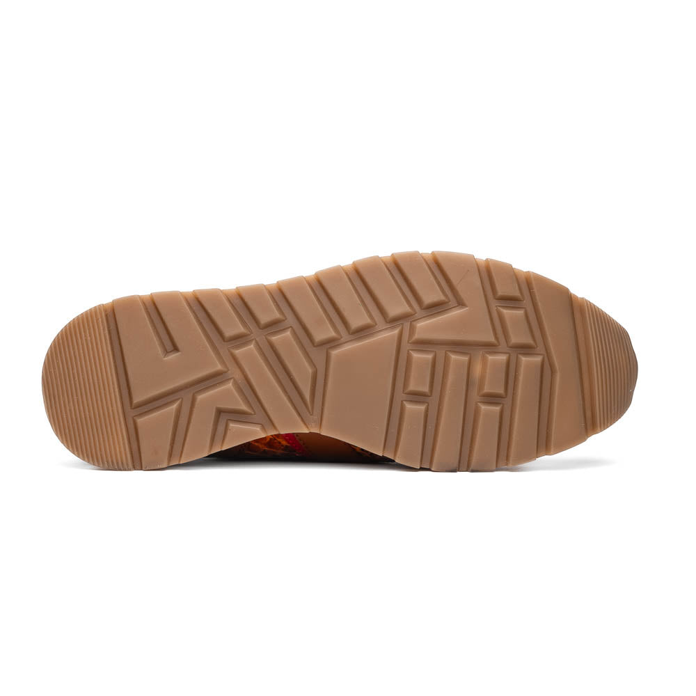 The Marco Di Milano Brescia Antique Cognac sneakers feature brown textured leather, a patterned design, lace-up fronts, white midsoles, and tan rubber outsoles. One shoe is propped against the other.