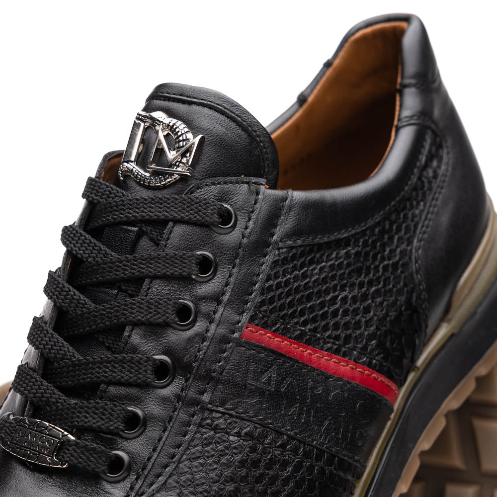 The Marco Di Milano Brescia Black sneakers feature textured black leather, black laces, a red side stripe, and brown rubber soles—one shoe stands upright while the other lies on its side.