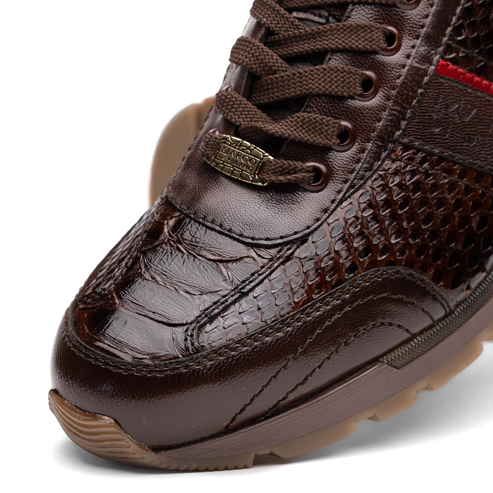 The Marco Di Milano Brescia Brown sneakers feature dark brown python-textured leather, a gold logo on the tongue, and a red stripe detail, with one shoe propped on the other—ideal for luxury footwear enthusiasts.