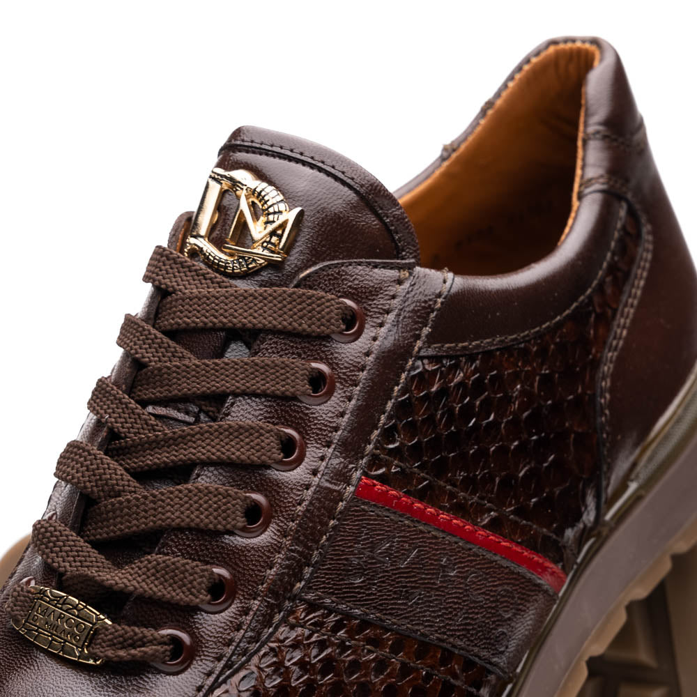 The Marco Di Milano Brescia Brown sneakers feature dark brown python-textured leather, a gold logo on the tongue, and a red stripe detail, with one shoe propped on the other—ideal for luxury footwear enthusiasts.