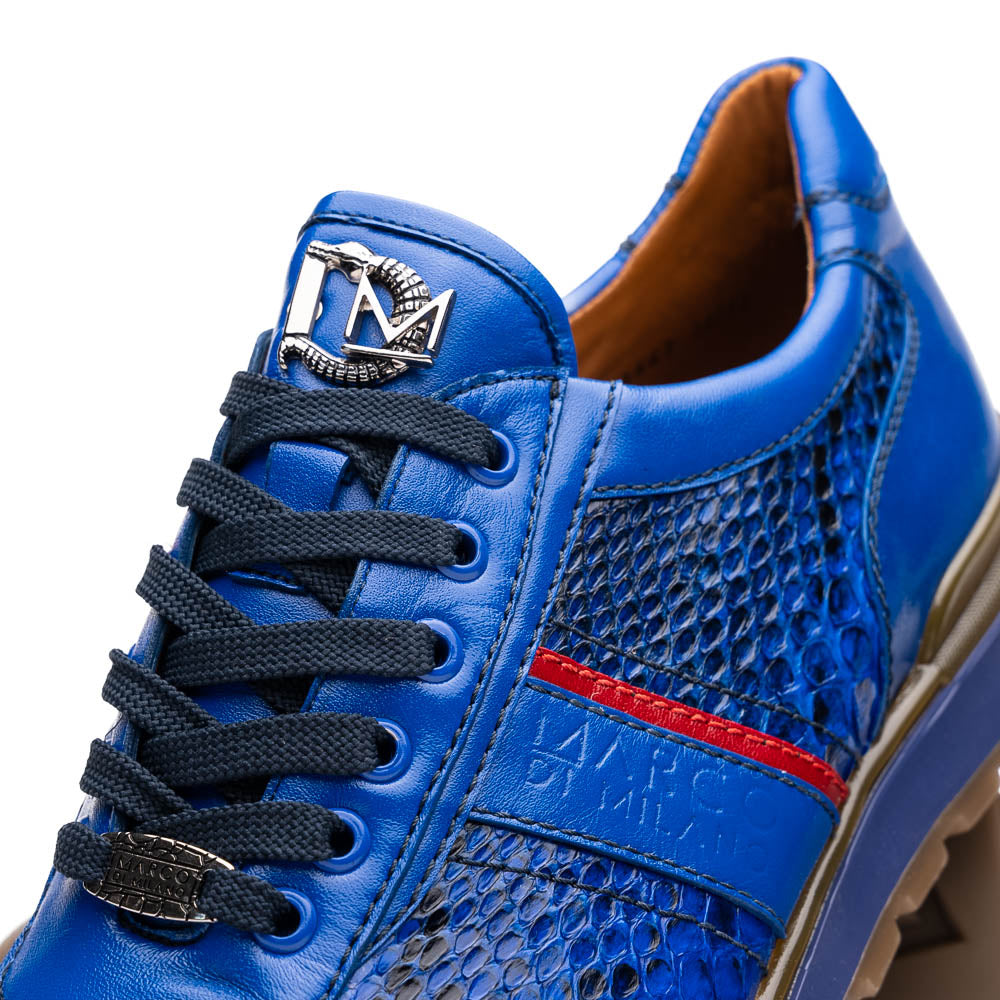 The Brescia Electric Blue sneakers by Marco Di Milano feature blue python leather, black laces, a red stripe, hand-painted side panels, and brown rubber soles—displayed with one shoe upright and the other on its side.