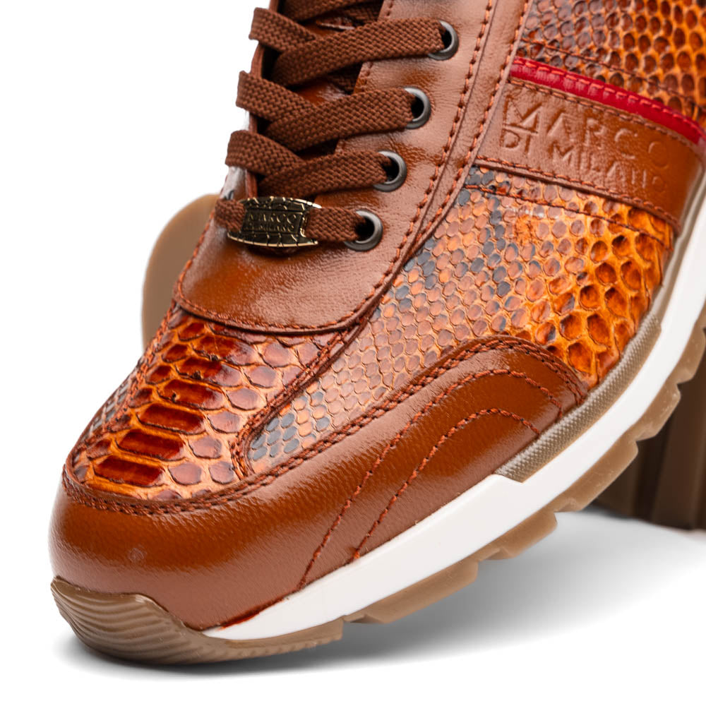 The Marco Di Milano Brescia Honey is a brown leather python fashion sneaker featuring a textured snakeskin pattern, red accent stripe, and thick rubber sole—luxury footwear redefined.