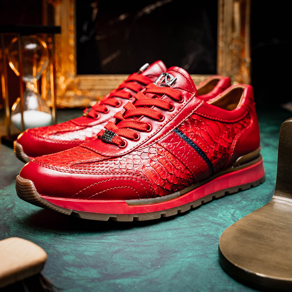 The Marco Di Milano Brescia Red sneakers feature red leather with a python-inspired texture, rubber sole, and lace-up design—shown with one shoe upright and the other displaying the sole.