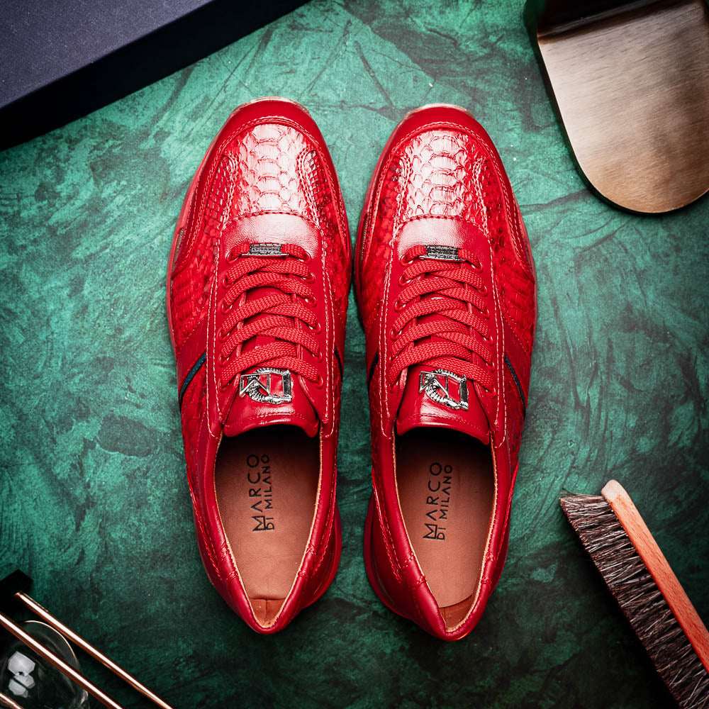The Marco Di Milano Brescia Red sneakers feature red leather with a python-inspired texture, rubber sole, and lace-up design—shown with one shoe upright and the other displaying the sole.