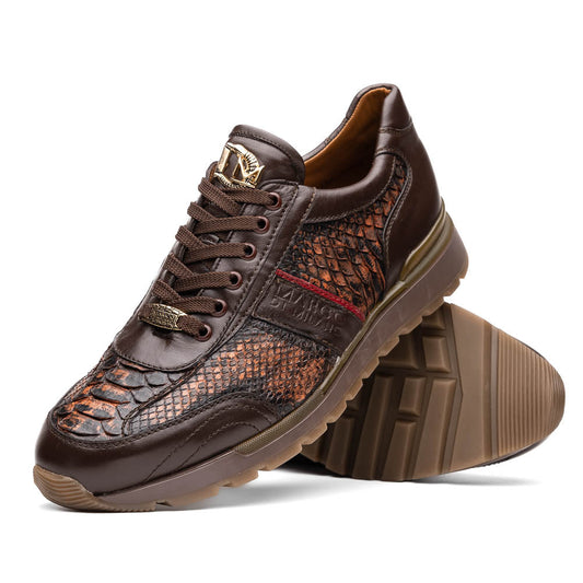 The Marco Di Milano Brescia Washed Cognac sneakers feature brown leather with a snakeskin pattern, gold accents, and rubber soles; one shoe is propped stylishly against the other, showcasing luxury footwear appeal.
