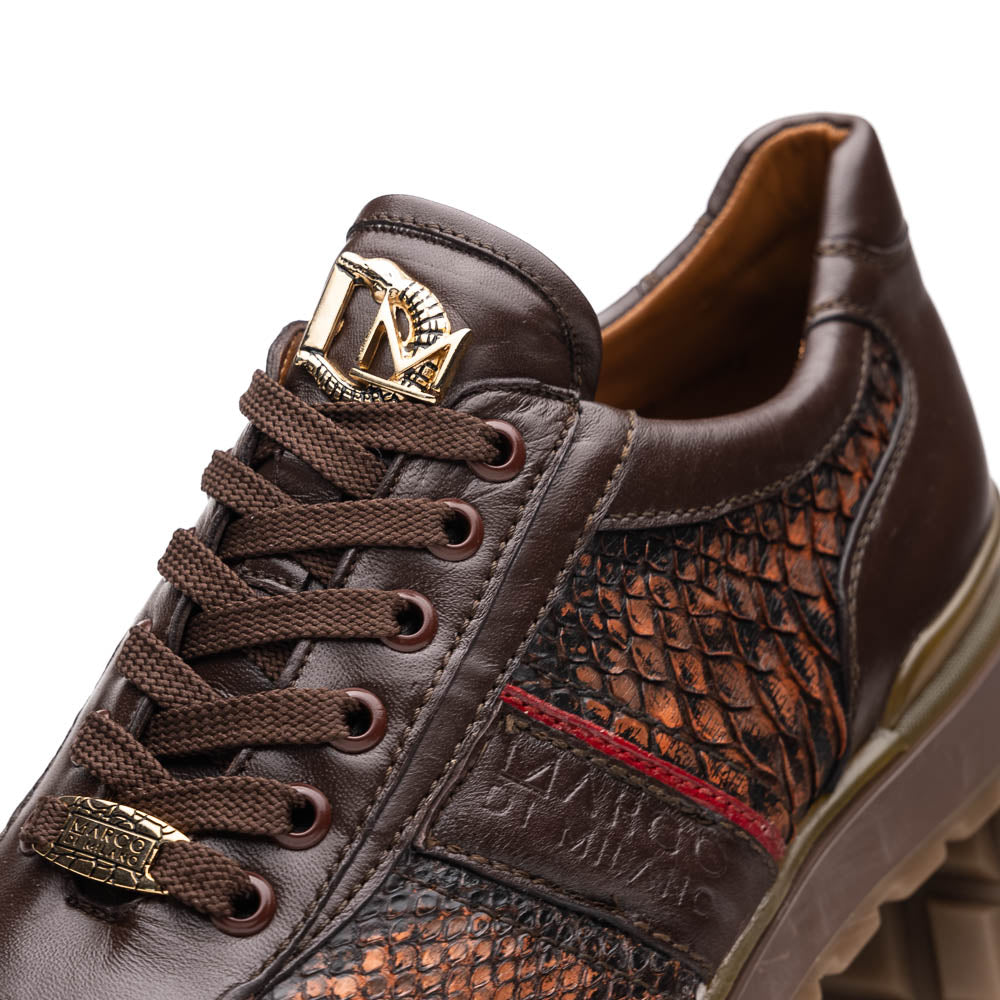 The Marco Di Milano Brescia Washed Cognac sneakers feature brown leather with a snakeskin pattern, gold accents, and rubber soles; one shoe is propped stylishly against the other, showcasing luxury footwear appeal.