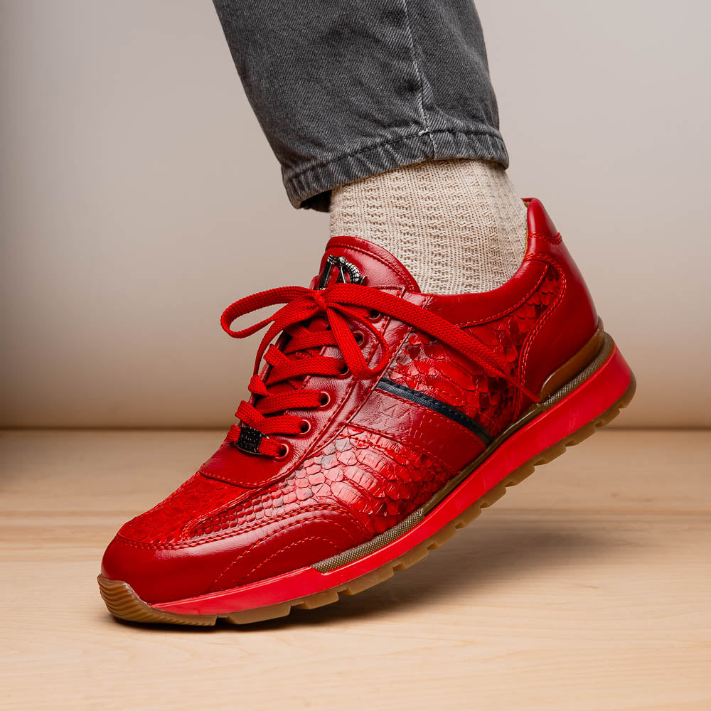 The Marco Di Milano Brescia Red sneakers feature red leather with a python-inspired texture, rubber sole, and lace-up design—shown with one shoe upright and the other displaying the sole.