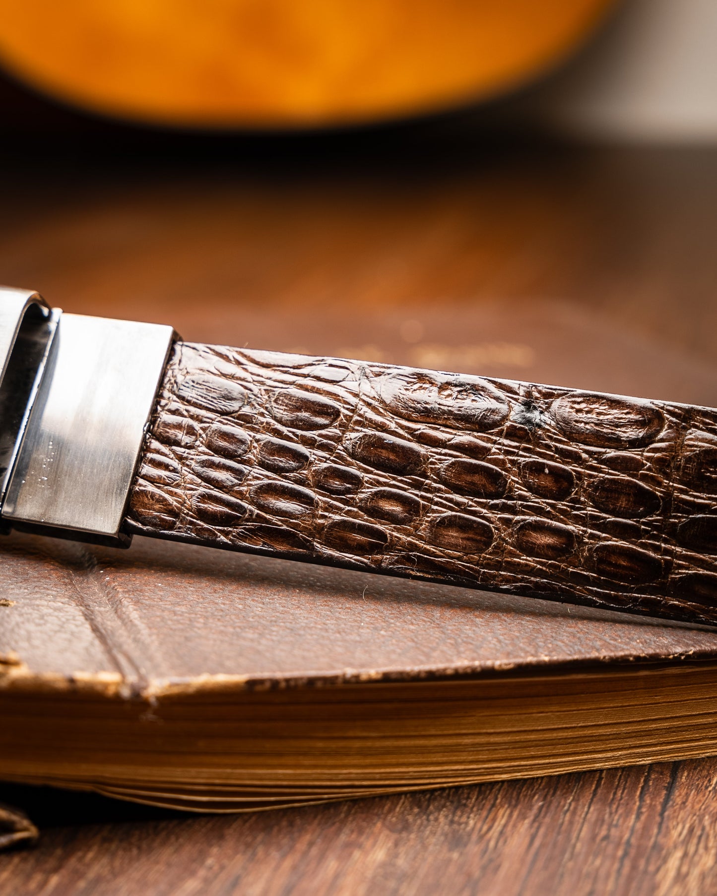 The Massimo Belt Brown by Marco Di Milano features an exotic caiman flank design and a silver engraved buckle—an elegant accessory to pair with your luxury footwear collection.