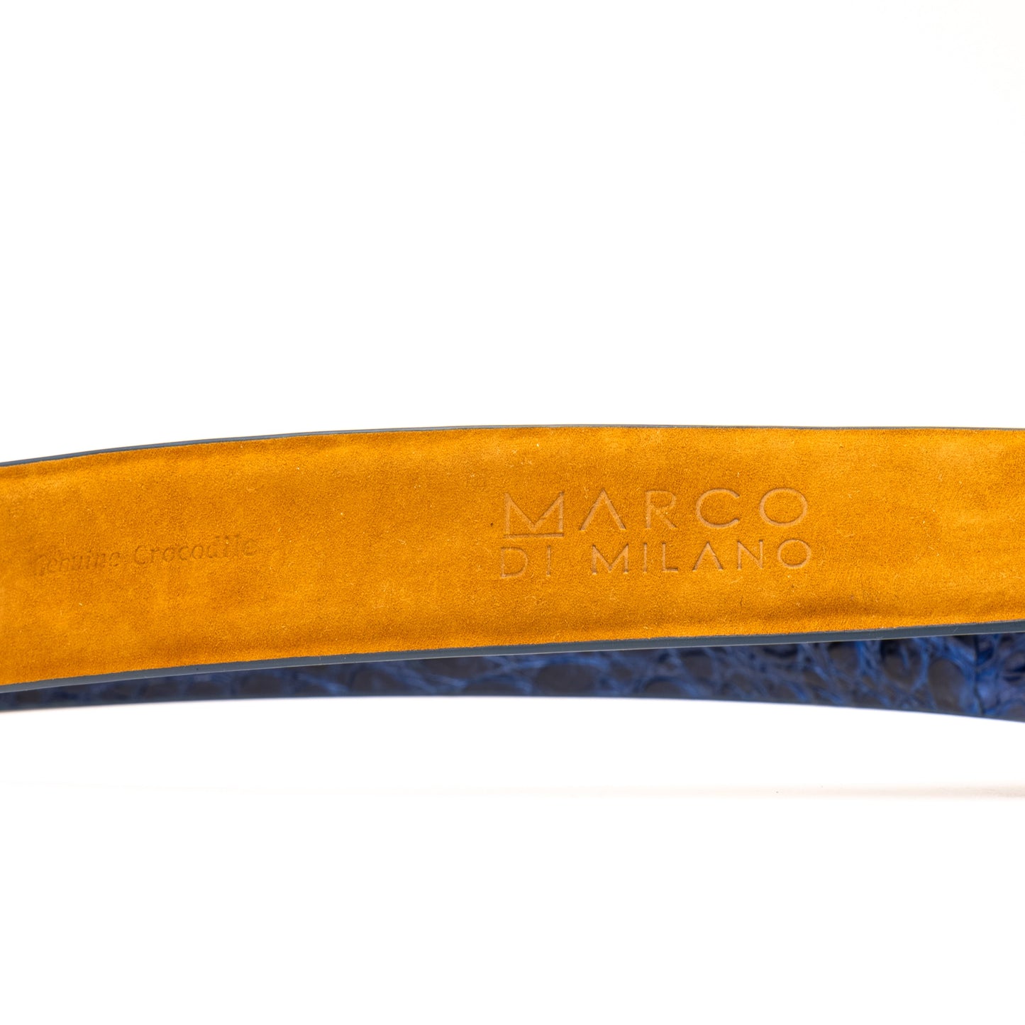 The Massimo Belt Navy by Marco Di Milano features blue crocodile-embossed leather, a silver rectangular buckle engraved with "MD," inspired by genuine caiman flank belts, and finished with elegant hand-painted details.