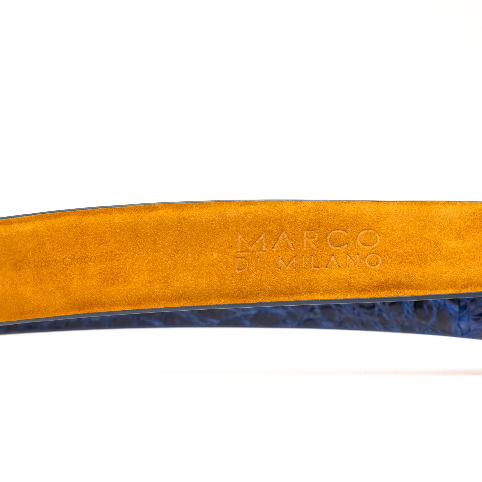 The Massimo Belt Navy by Marco Di Milano features blue crocodile-embossed leather, a silver rectangular buckle engraved with "MD," inspired by genuine caiman flank belts, and finished with elegant hand-painted details.