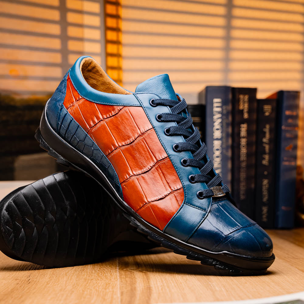 The Marco Di Milano Cairo Blue Jeans/Honey low-top sneakers showcase blue and orange genuine alligator leather with black laces and textured black rubber soles for a luxurious look.