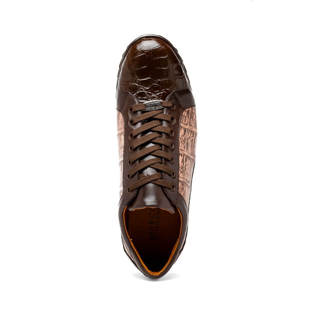 The Marco Di Milano Cairo Brown/Orix men's sneakers feature brown luxury footwear with textured panels and rubber soles, crafted to resemble genuine alligator. One shoe stands upright while the other lies on its side.