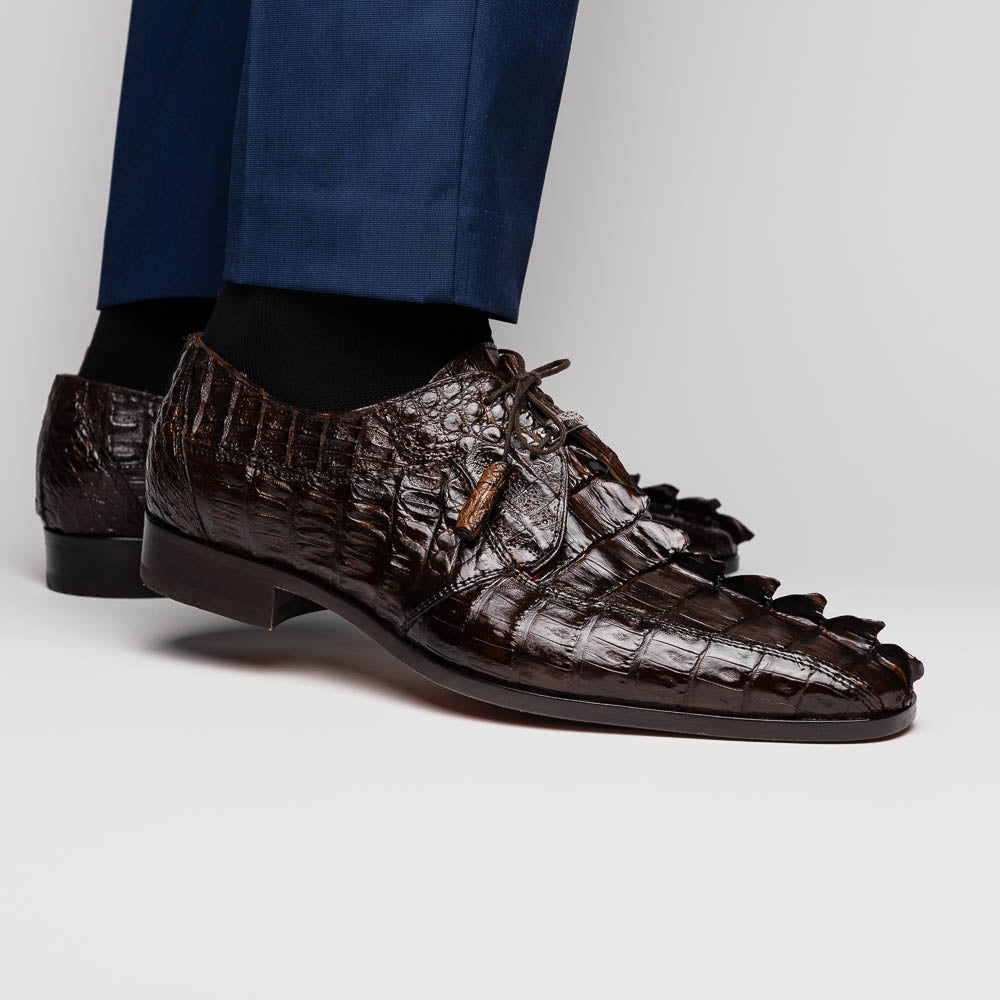 A pair of Marco Di Milano Cancun Brown derby shoes in dark brown hornback caiman crocodile leather—one displays the textured upper, while the other reveals the hand-painted exotic sole embossed with the brand.