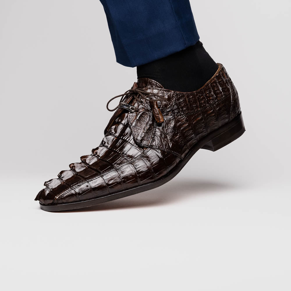 A pair of Marco Di Milano Cancun Brown derby shoes in dark brown hornback caiman crocodile leather—one displays the textured upper, while the other reveals the hand-painted exotic sole embossed with the brand.