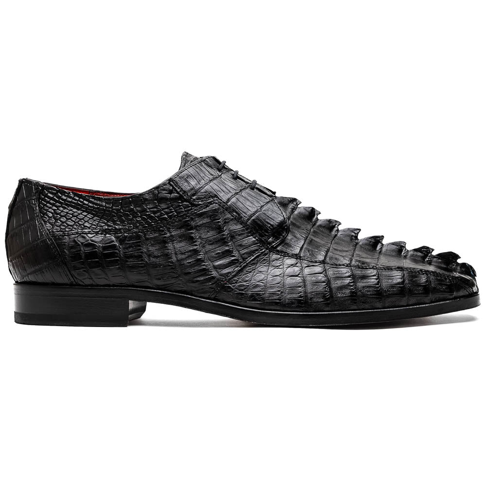 The Marco Di Milano Cancun Black features genuine hornback caiman crocodile shoes with a pointed toe, one upright and the other showing the branded brown leather sole—a striking choice in men's exotic footwear.