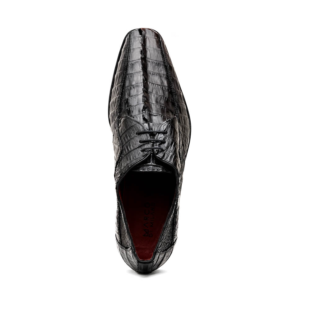 The Marco Di Milano Cancun Black features genuine hornback caiman crocodile shoes with a pointed toe, one upright and the other showing the branded brown leather sole—a striking choice in men's exotic footwear.
