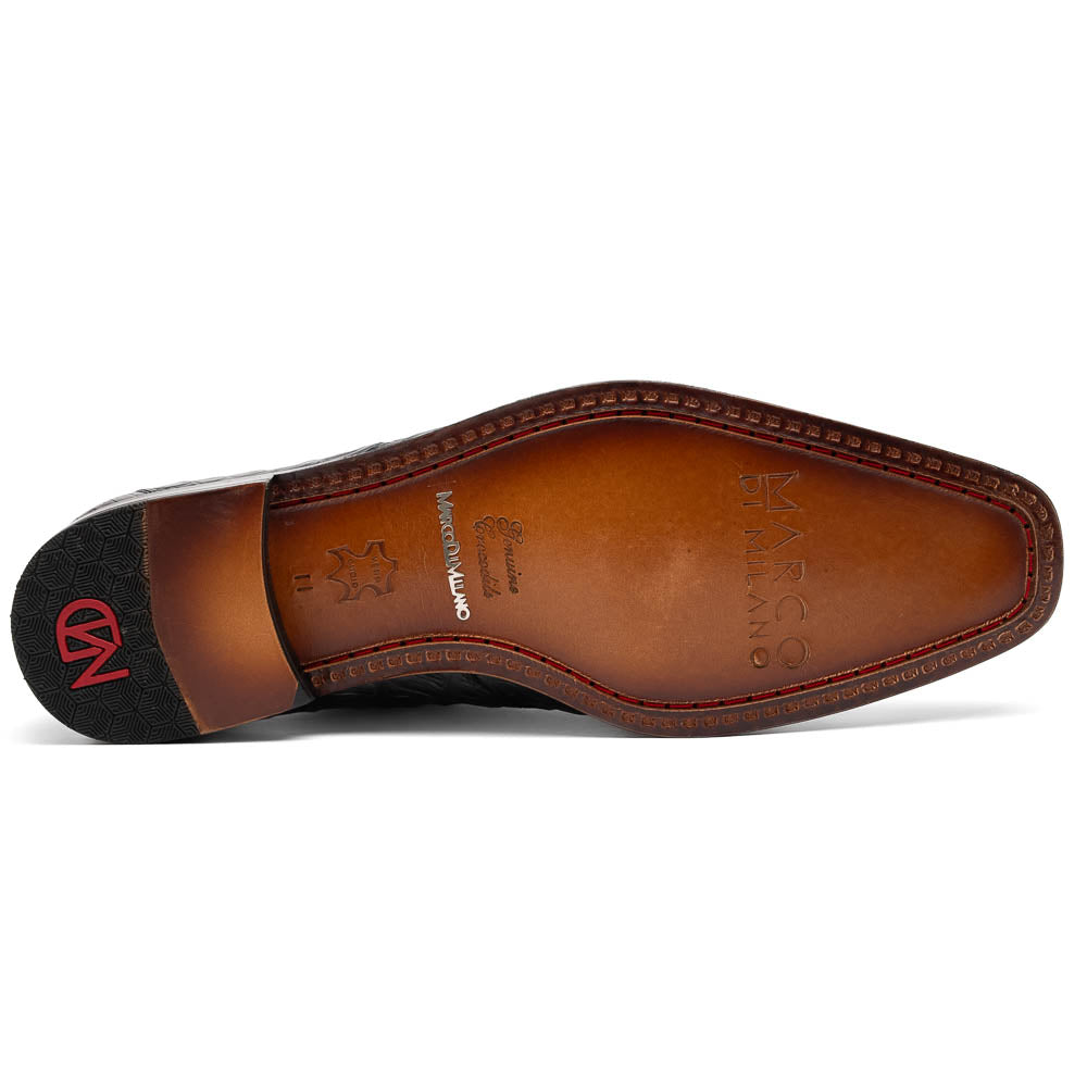 The Marco Di Milano Cancun Black features genuine hornback caiman crocodile shoes with a pointed toe, one upright and the other showing the branded brown leather sole—a striking choice in men's exotic footwear.