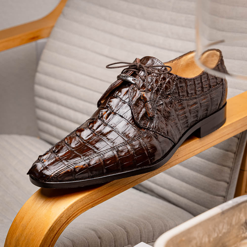 A pair of Marco Di Milano Cancun Brown derby shoes in dark brown hornback caiman crocodile leather—one displays the textured upper, while the other reveals the hand-painted exotic sole embossed with the brand.