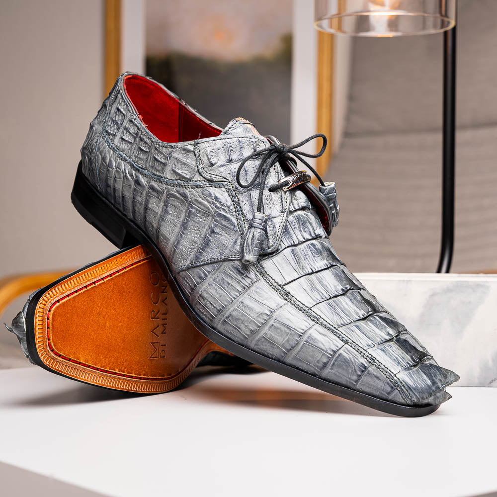The Marco Di Milano Cancun Gray is a luxury men's derby shoe made from genuine hornback caiman crocodile leather in gray, with black laces, red lining, and brown leather soles—an exquisite choice in exotic footwear.