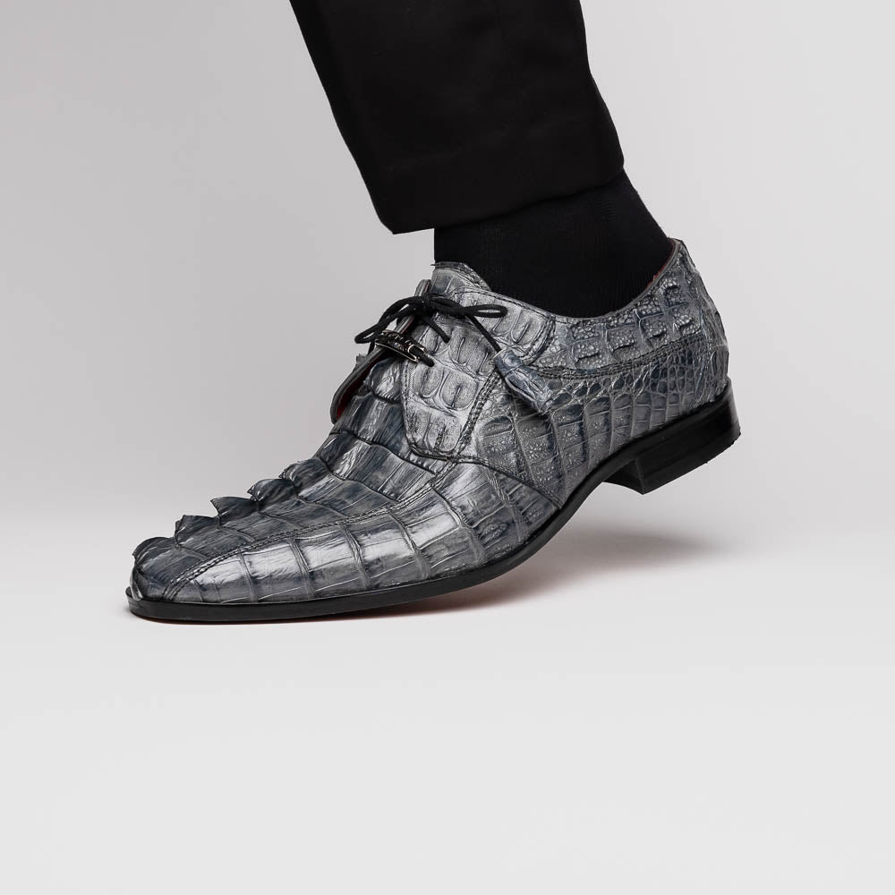 The Marco Di Milano Cancun Gray is a luxury men's derby shoe made from genuine hornback caiman crocodile leather in gray, with black laces, red lining, and brown leather soles—an exquisite choice in exotic footwear.