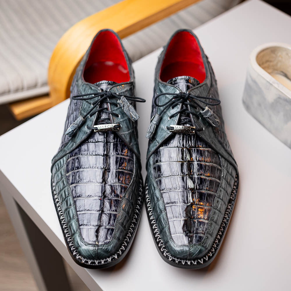 The Caribe Dark Gray by Marco Di Milano is a pair of luxury derby shoes crafted from genuine hornback caiman crocodile, with black laces and a brown leather sole—a standout in exotic footwear.