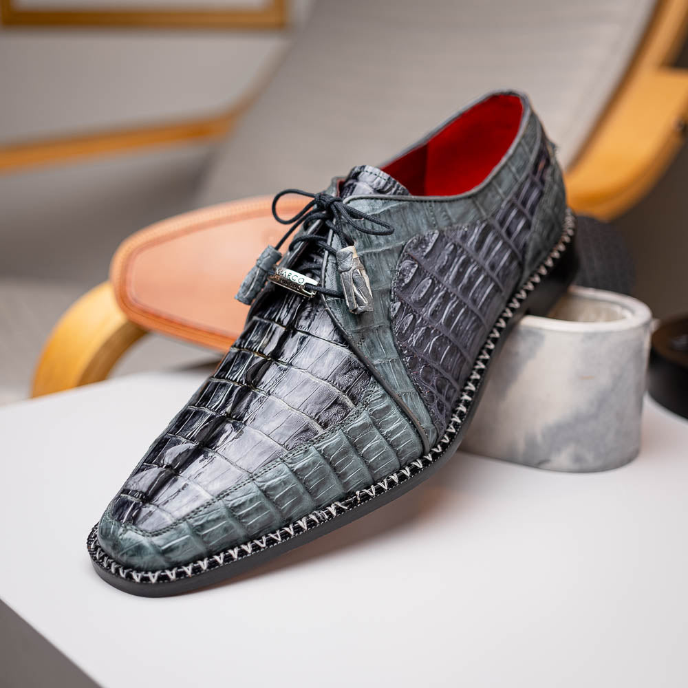 The Caribe Dark Gray by Marco Di Milano is a pair of luxury derby shoes crafted from genuine hornback caiman crocodile, with black laces and a brown leather sole—a standout in exotic footwear.