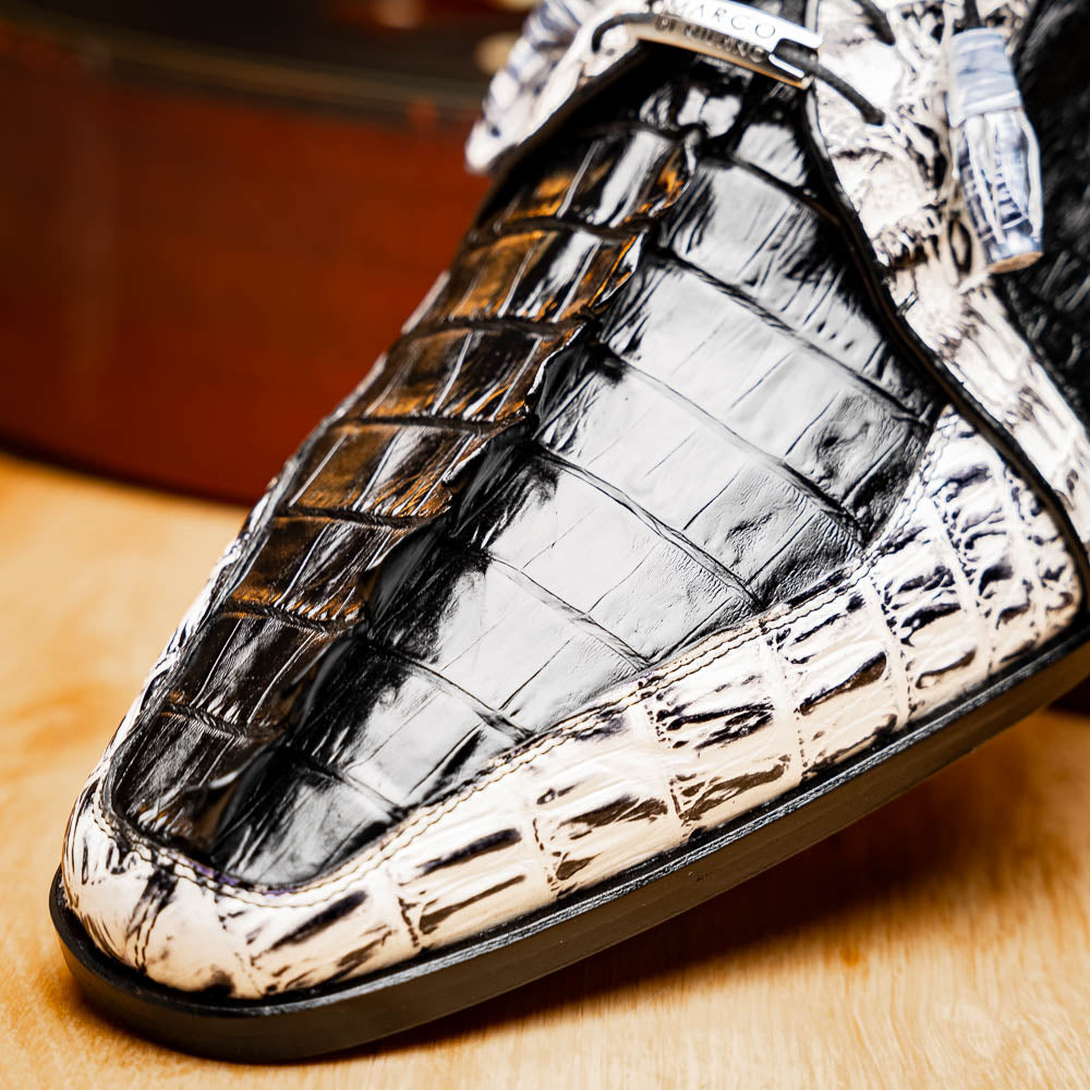 The Marco Di Milano Caribe Black / Newspaper are luxury men's derby shoes crafted from genuine hornback caiman crocodile leather in black and white, featuring red lining, leather soles, lace-up closures, and decorative tassels.
