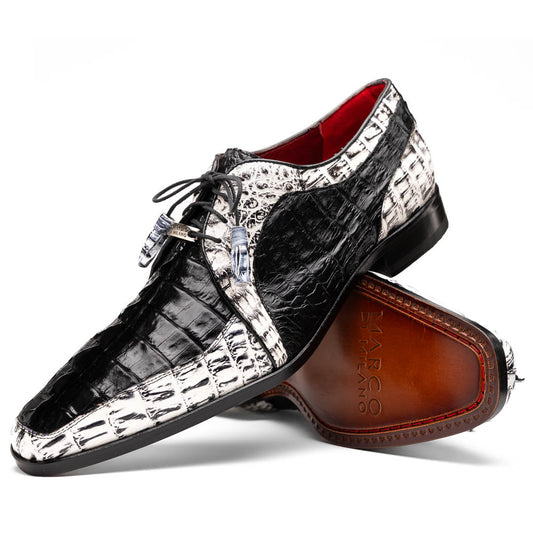 The Marco Di Milano Caribe Black / Newspaper are luxury men's derby shoes crafted from genuine hornback caiman crocodile leather in black and white, featuring red lining, leather soles, lace-up closures, and decorative tassels.