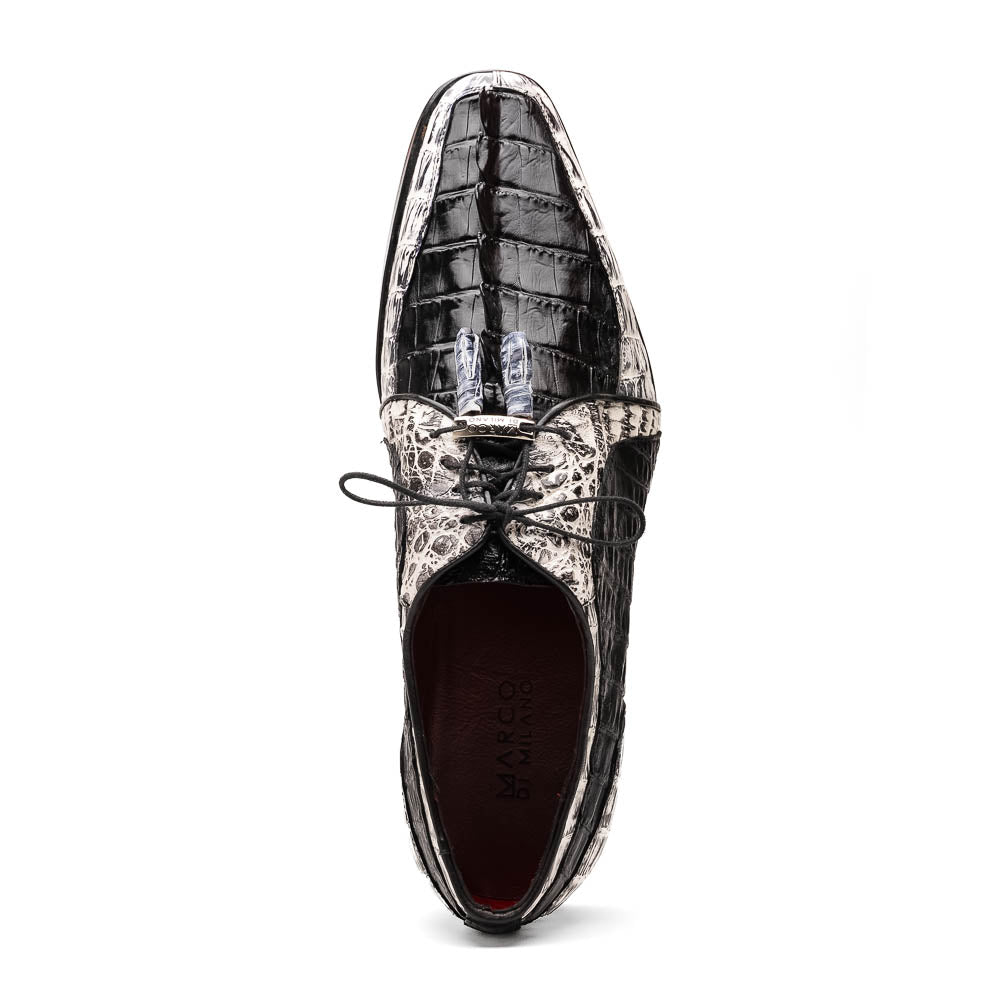 The Marco Di Milano Caribe Black / Newspaper are luxury men's derby shoes crafted from genuine hornback caiman crocodile leather in black and white, featuring red lining, leather soles, lace-up closures, and decorative tassels.