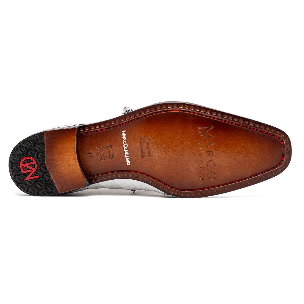 The Marco Di Milano Caribe White / Newspaper Derby shoes feature white and black crocodile-patterned leather, one upright and one on its side to showcase a brown leather sole with red stitching—distinctive, exotic hand-painted footwear.