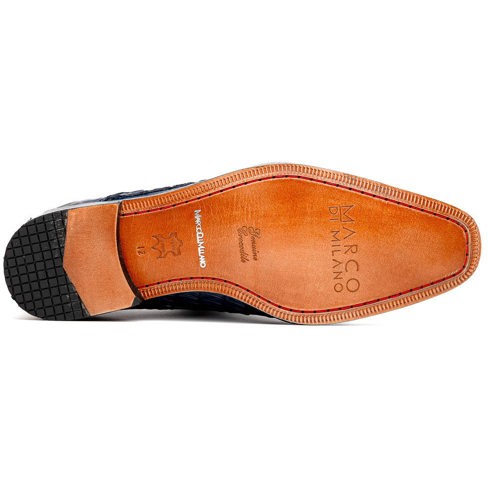 The Marco Di Milano Caribe Rustic Orix/Brown features luxury derby shoes crafted from genuine hornback caiman crocodile leather, with one upright and the other on its side showcasing a tan sole, visible stitching, and hand-painted finishes.