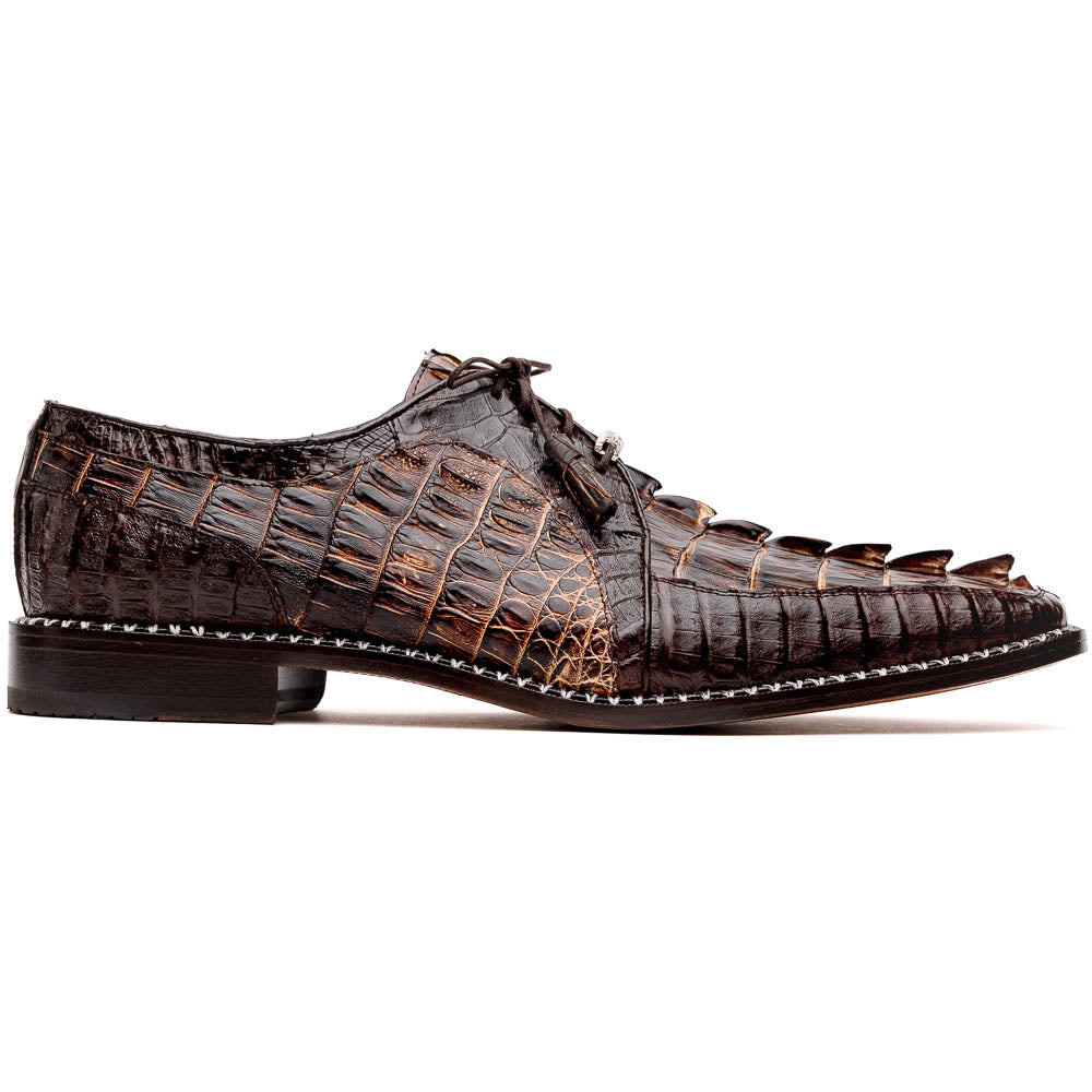 The Marco Di Milano Caribe Rustic Orix/Brown features luxury derby shoes crafted from genuine hornback caiman crocodile leather, with one upright and the other on its side showcasing a tan sole, visible stitching, and hand-painted finishes.