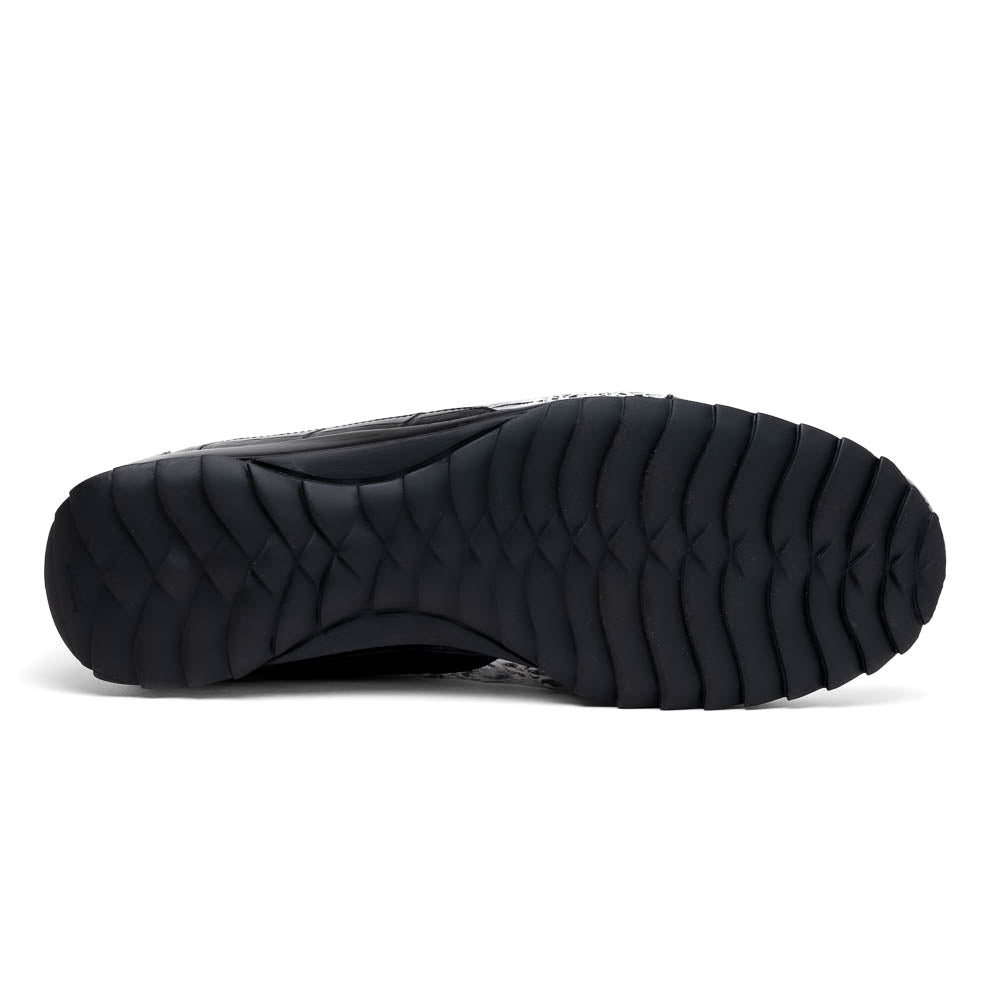 The Marco Di Milano Cairo Black/White sneakers feature a black and white low-top design, crocodile texture details, black laces, and thick black rubber soles—ideal for those seeking luxury footwear with a unique edge.