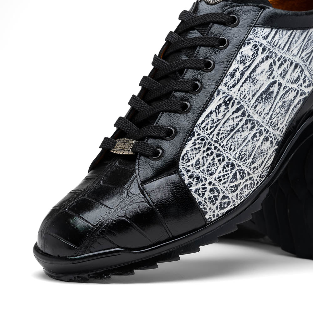The Marco Di Milano Cairo Black/White sneakers feature a black and white low-top design, crocodile texture details, black laces, and thick black rubber soles—ideal for those seeking luxury footwear with a unique edge.