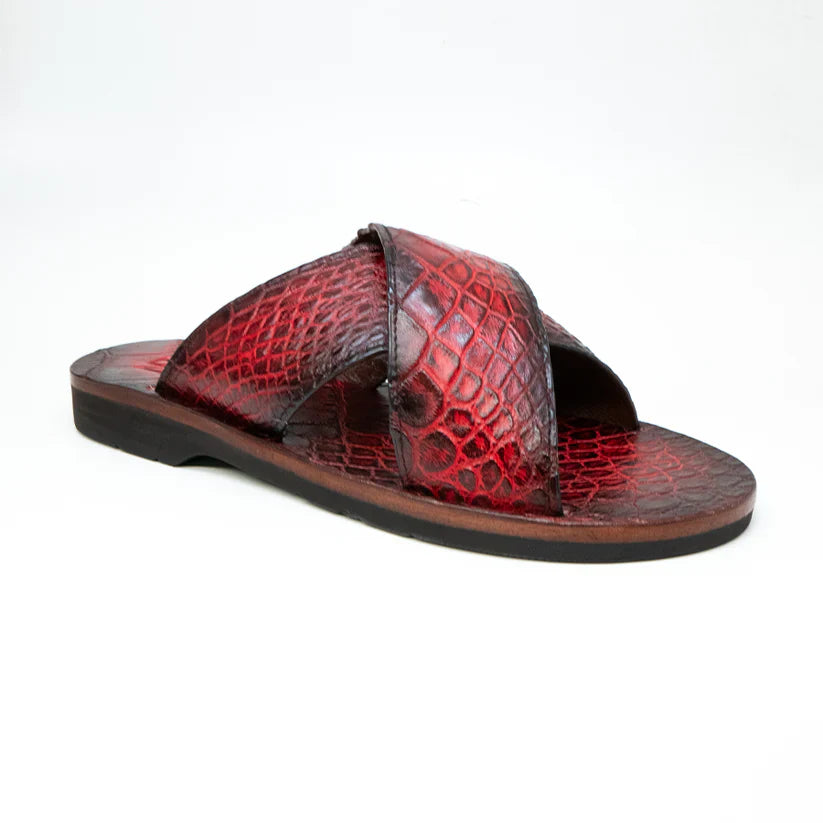The Elios Black Cherry by Marco Di Milano is a red, textured leather slide sandal featuring crisscross straps and a flat black sole, displayed against a plain white background.