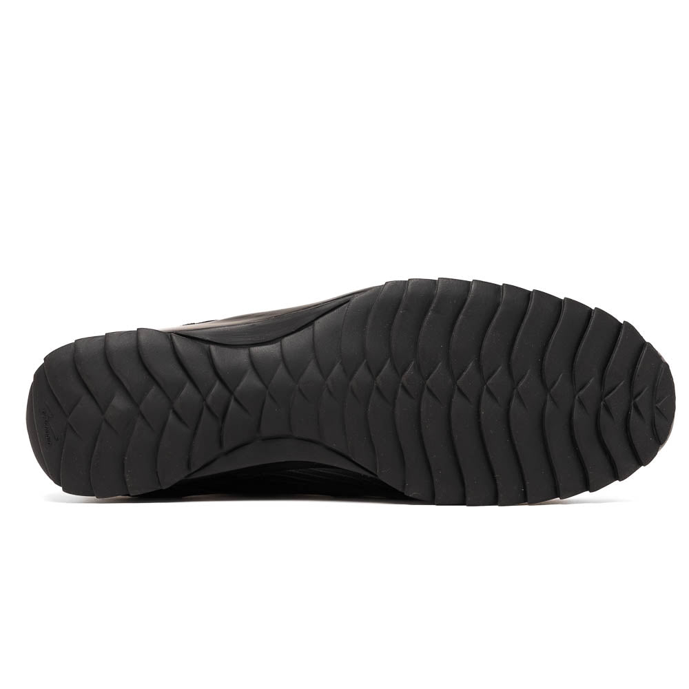 The Crater Black by Marco Di Milano features black textured leather with a crocodile pattern and metallic logo accents, exemplifying genuine exotic shoe craftsmanship—one shoe stands upright, the other lies on its side.