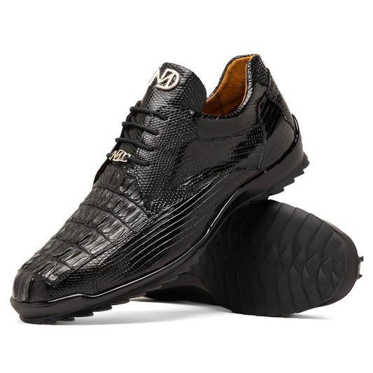 The Crater Black by Marco Di Milano features black textured leather with a crocodile pattern and metallic logo accents, exemplifying genuine exotic shoe craftsmanship—one shoe stands upright, the other lies on its side.