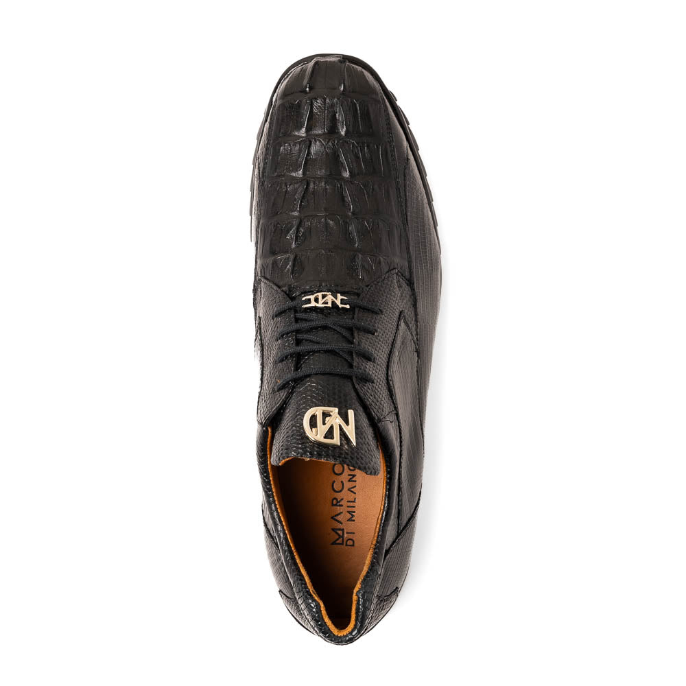 The Crater Black by Marco Di Milano features black textured leather with a crocodile pattern and metallic logo accents, exemplifying genuine exotic shoe craftsmanship—one shoe stands upright, the other lies on its side.