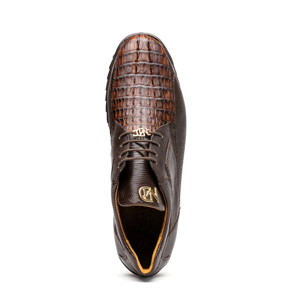 The Crater Brown by Marco Di Milano features brown textured leather with crocodile pattern accents, gold "MD" logos, and black rubber soles, blending dress shoe elegance with caiman hornback sneaker style.
